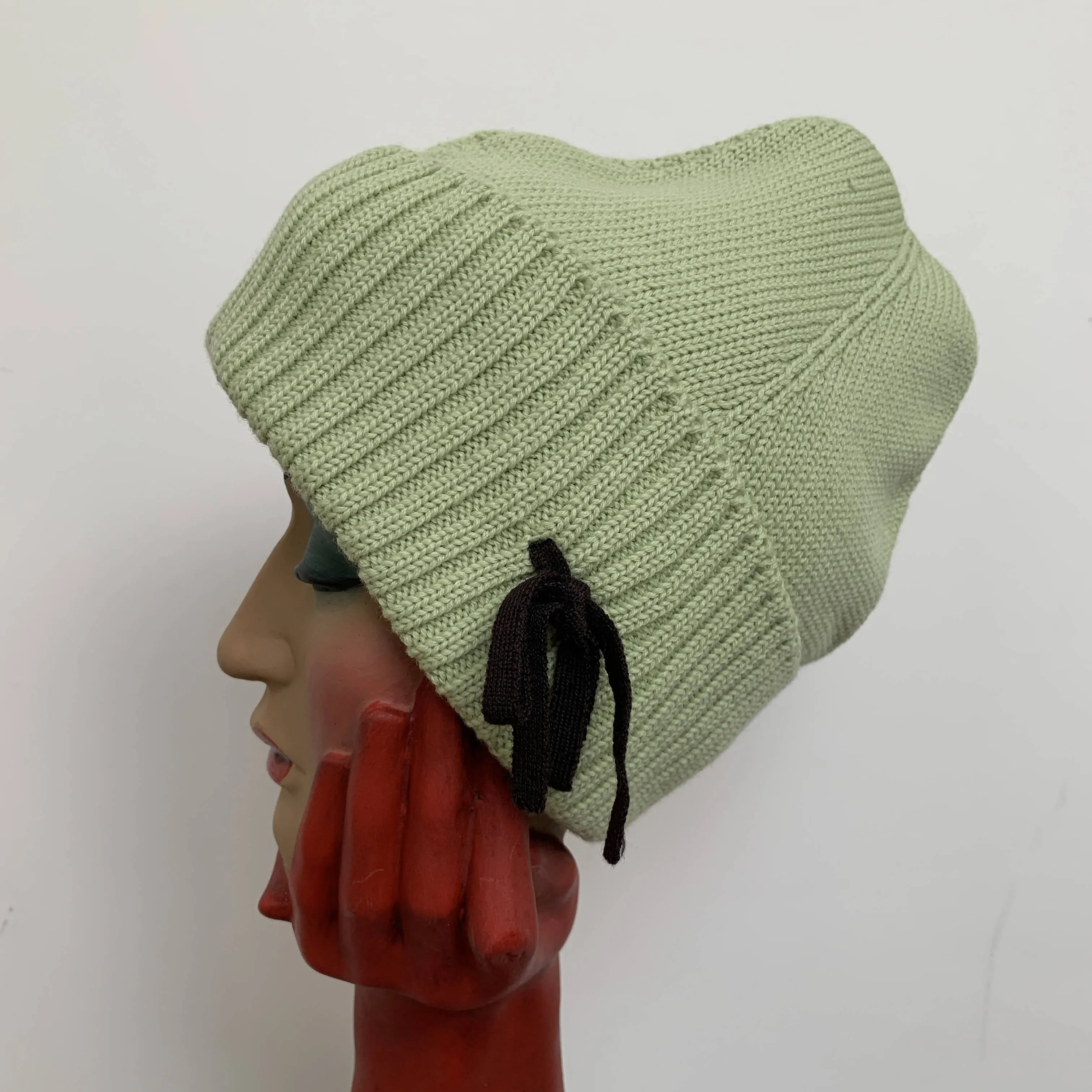 Vintage mint green wool beanie by Miu Miu made in Italy with black bow detail