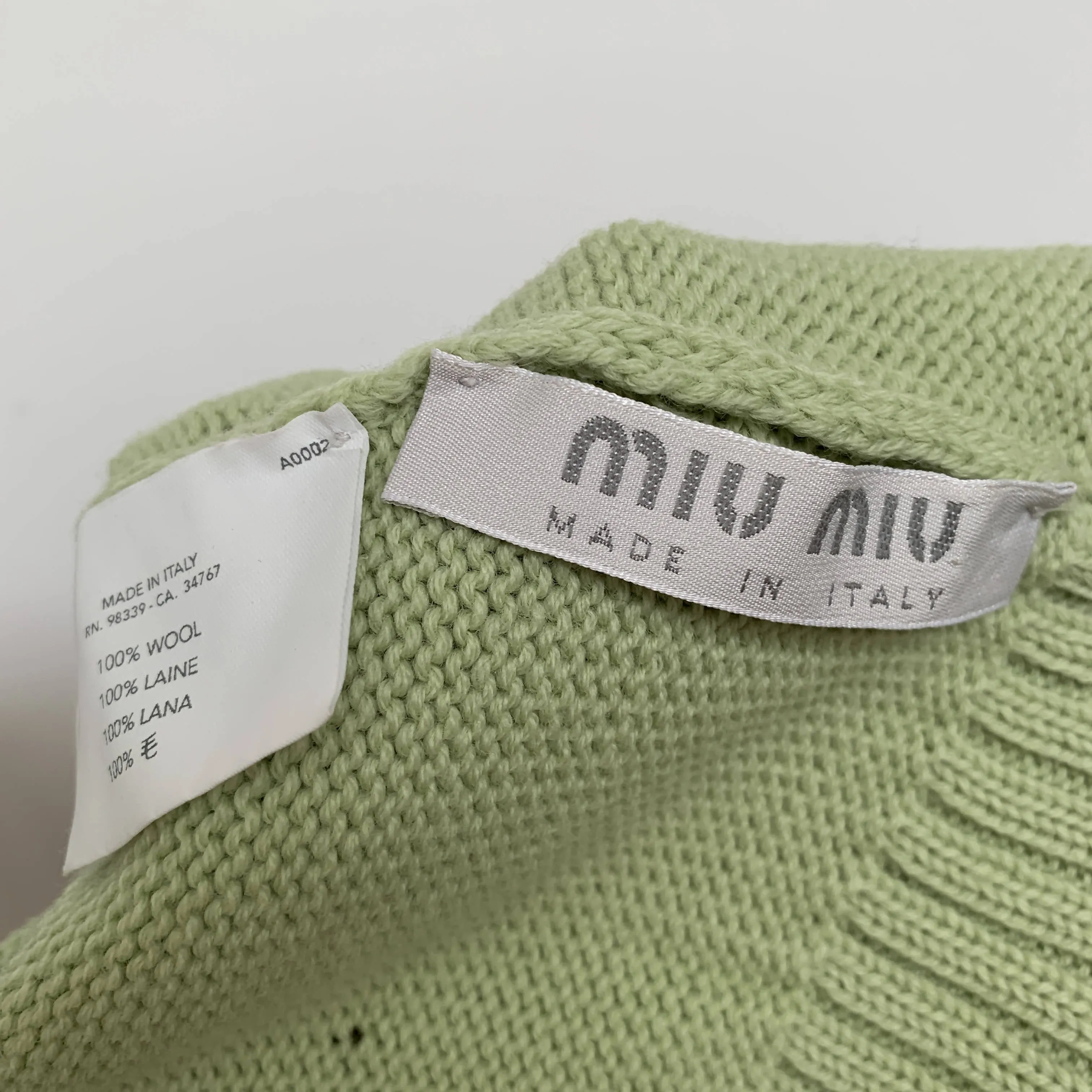 Vintage mint green wool beanie by Miu Miu made in Italy with black bow detail