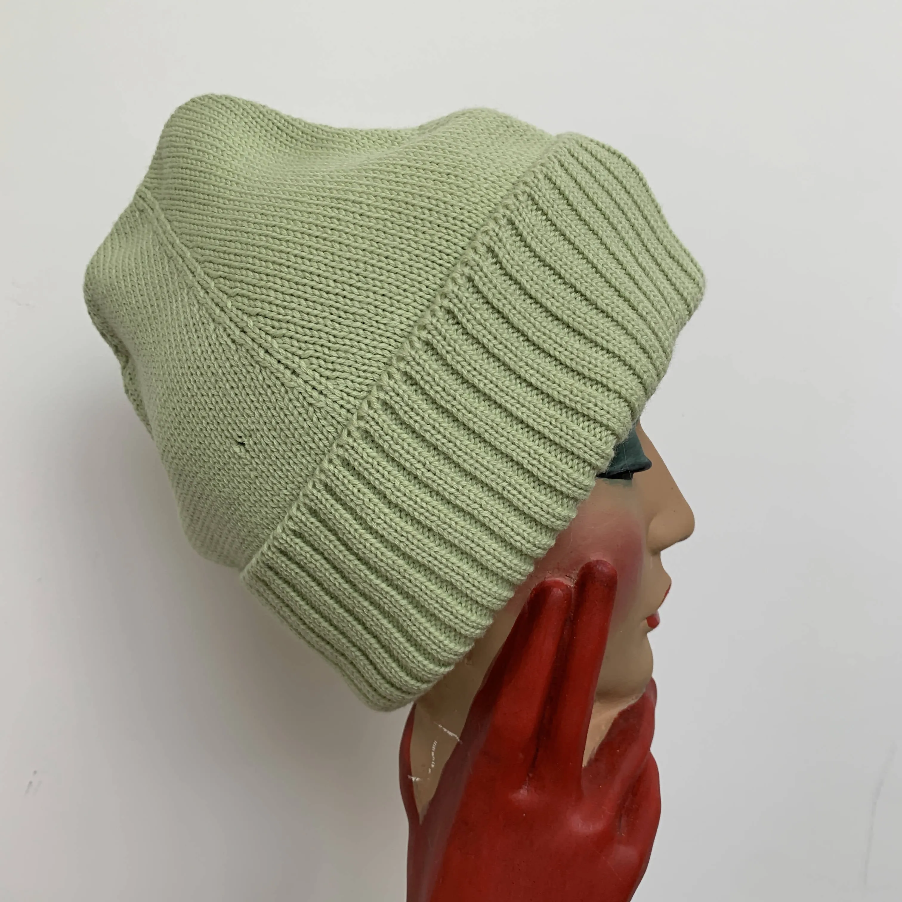 Vintage mint green wool beanie by Miu Miu made in Italy with black bow detail